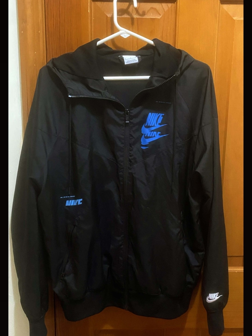 Nike Black Hooded Windbreaker with Blue Logo Accents